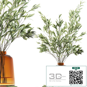 Olive stems in yellow glass vase with water